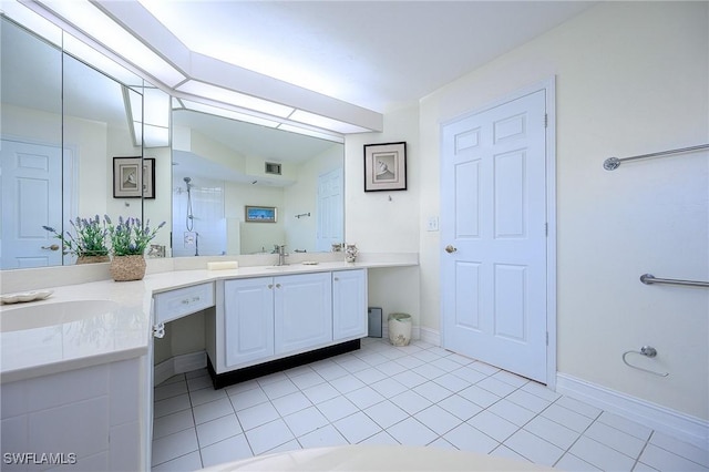 bathroom featuring visible vents, a walk in shower, tile patterned flooring, baseboards, and vanity