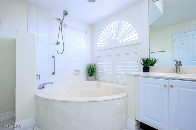 full bath featuring a bathing tub, vanity, and walk in shower