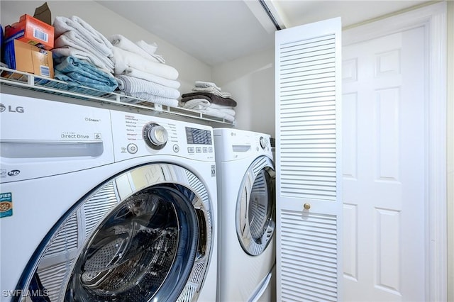 washroom featuring laundry area and washer and dryer