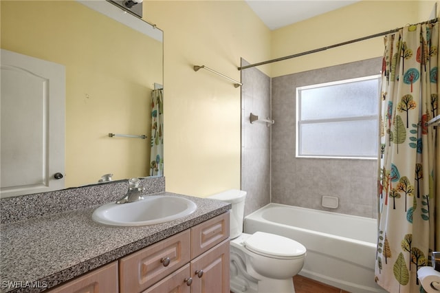 full bathroom featuring shower / tub combo, vanity, and toilet