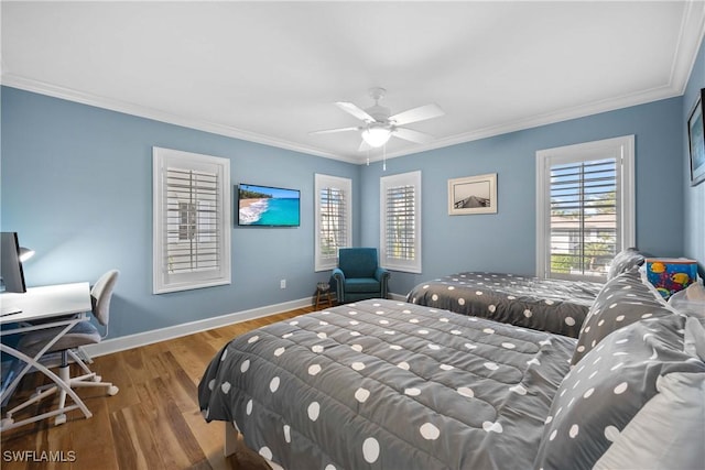 bedroom featuring ceiling fan, wood-type flooring, and ornamental molding