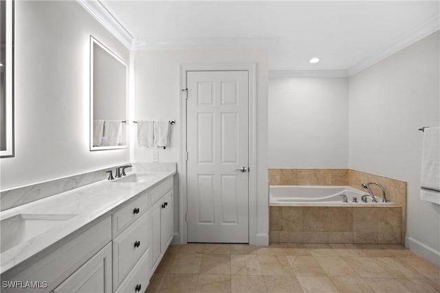 bathroom featuring tiled tub, crown molding, and vanity