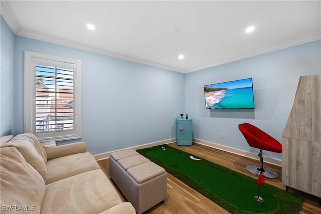 interior space featuring crown molding, golf simulator, and hardwood / wood-style flooring