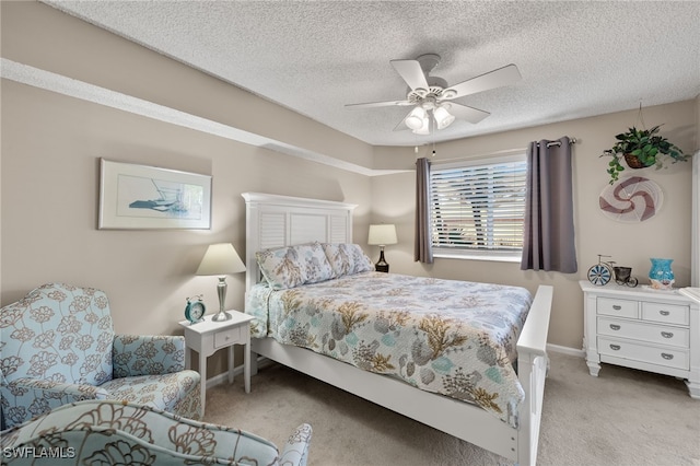 bedroom with light carpet, a textured ceiling, and ceiling fan