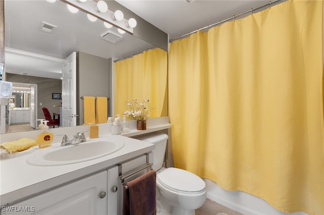 full bathroom featuring shower / tub combo, vanity, and toilet