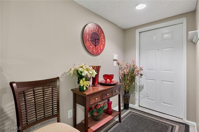 entrance foyer featuring a textured ceiling