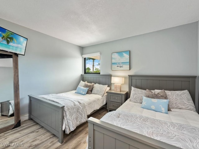 bedroom featuring light hardwood / wood-style floors