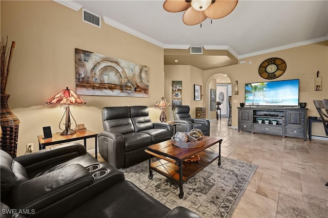 living area with crown molding, visible vents, arched walkways, and stone tile flooring