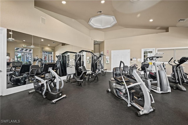 gym with high vaulted ceiling, visible vents, and recessed lighting