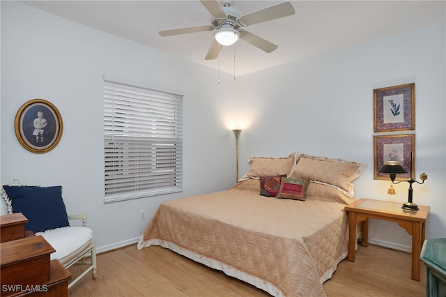 bedroom with ceiling fan and light wood-type flooring