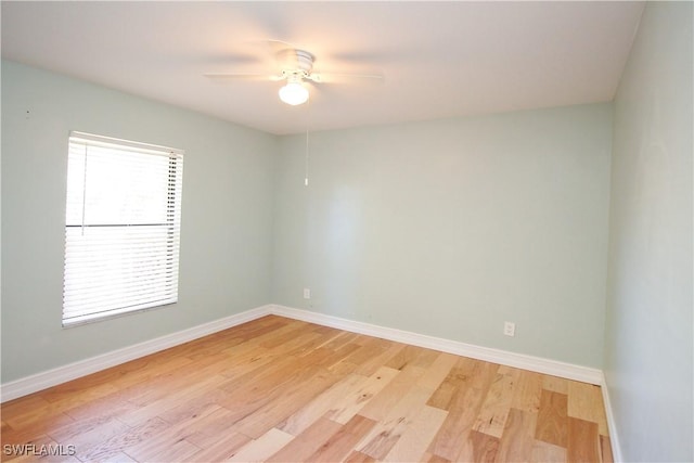 spare room featuring ceiling fan and light hardwood / wood-style floors