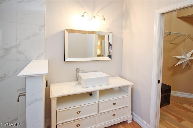 bathroom with vanity and wood-type flooring