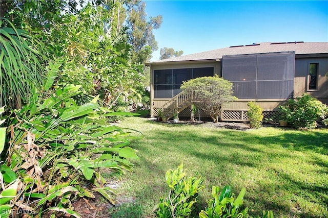 view of yard with a sunroom