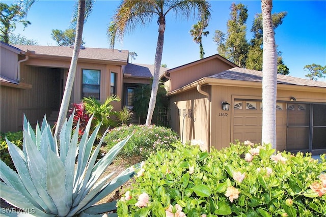 view of side of home with a garage