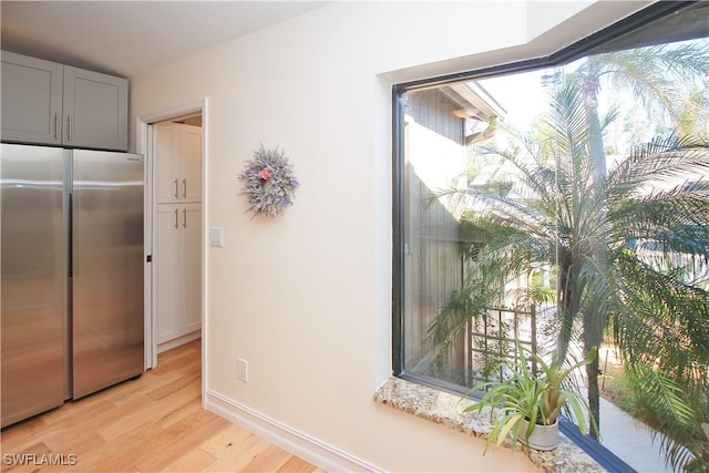 interior space featuring hardwood / wood-style floors and high quality fridge