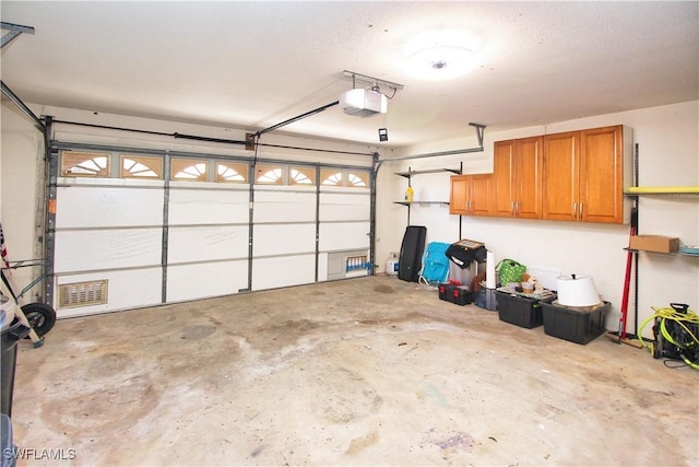 garage featuring a garage door opener