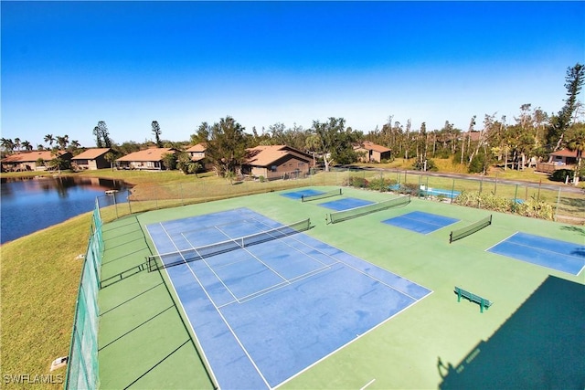 view of sport court with a water view