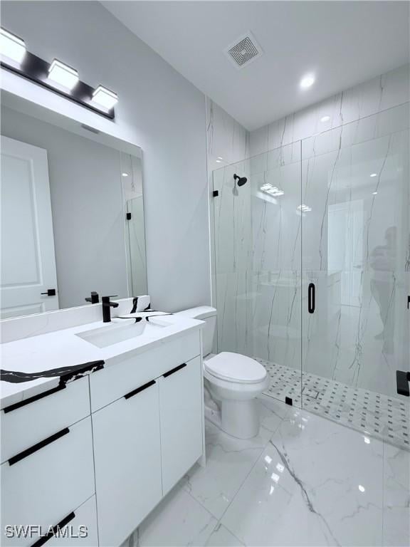 bathroom with vanity, toilet, and an enclosed shower