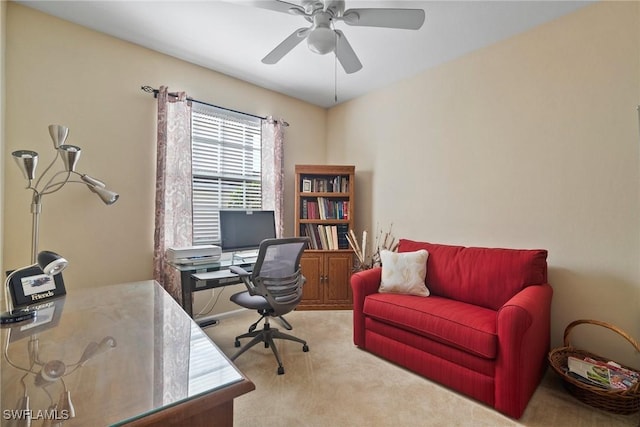 home office with light carpet and ceiling fan