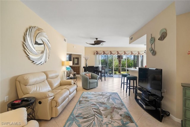 living room featuring light tile patterned flooring and ceiling fan