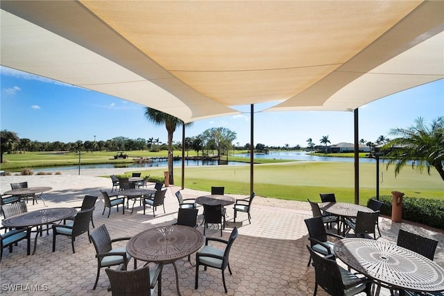 view of patio with a water view