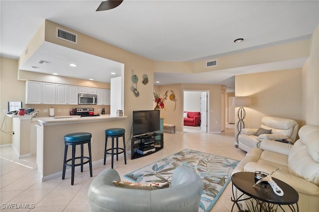 living room featuring light tile patterned floors