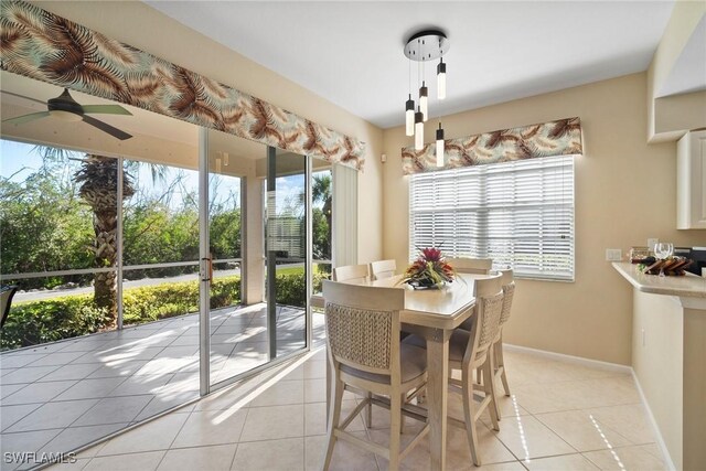 dining room featuring light tile patterned flooring and ceiling fan