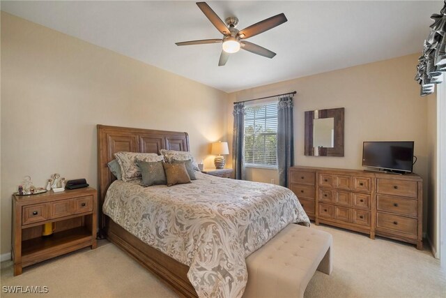 bedroom with light carpet and ceiling fan