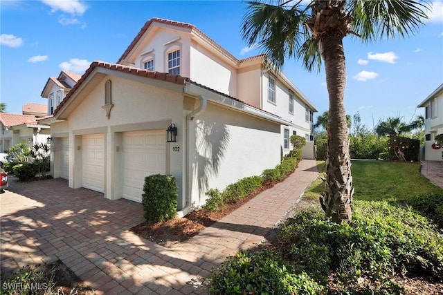 view of property exterior with a lawn