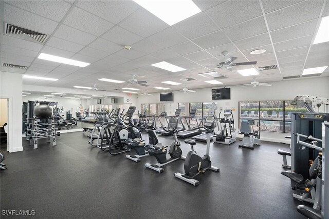 exercise room featuring a drop ceiling