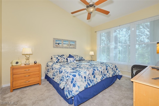 carpeted bedroom featuring ceiling fan and vaulted ceiling