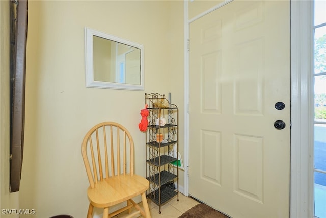 tiled foyer featuring plenty of natural light