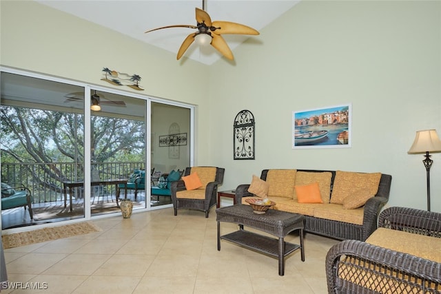 living room with lofted ceiling and light tile patterned flooring