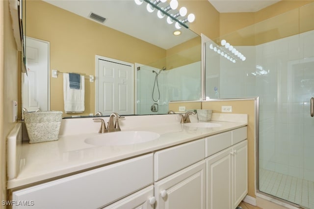 bathroom featuring vanity and walk in shower