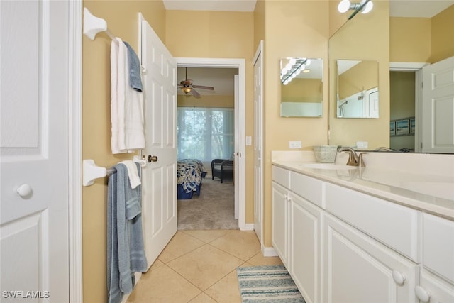 bathroom with tile patterned floors, ceiling fan, and vanity