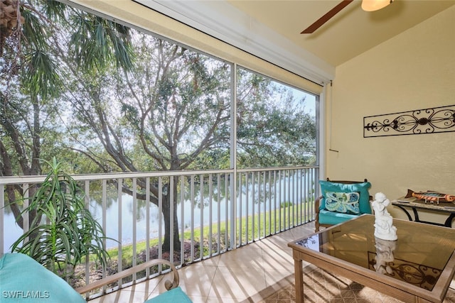 exterior space with a water view and ceiling fan