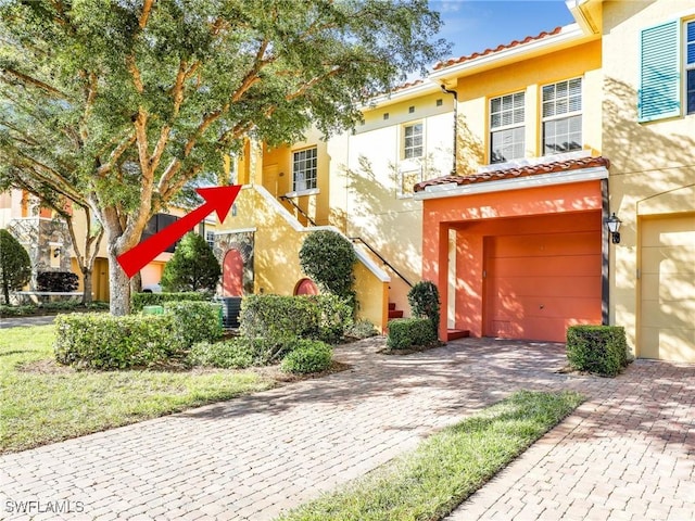 view of front of property with a garage