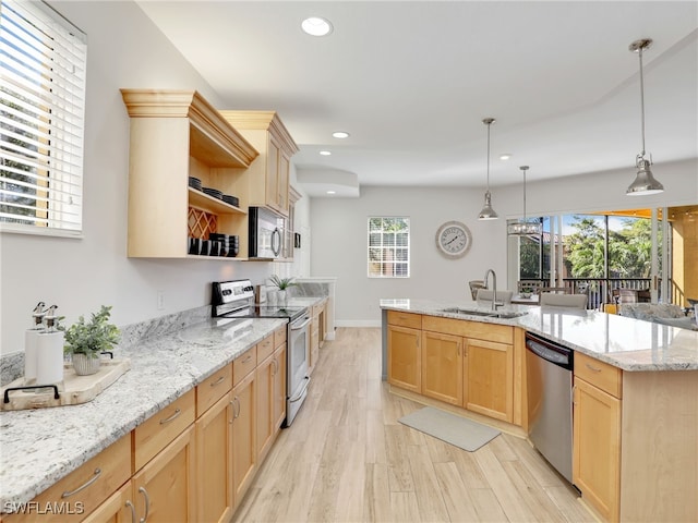 kitchen with light hardwood / wood-style floors, appliances with stainless steel finishes, light brown cabinets, pendant lighting, and sink