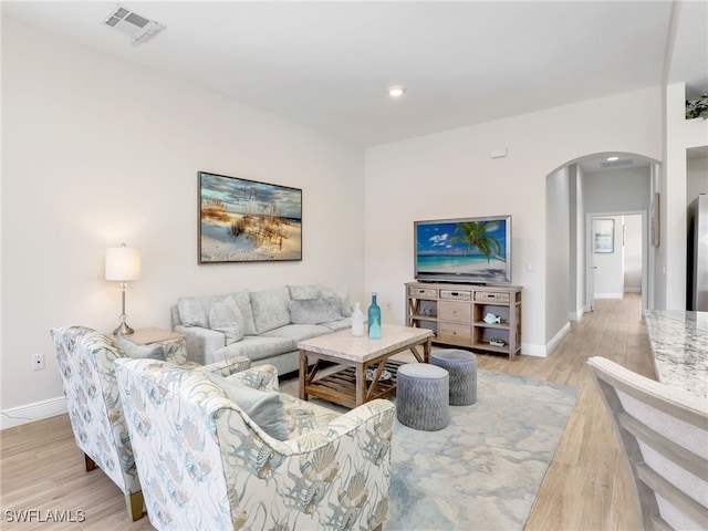 living room with light hardwood / wood-style floors