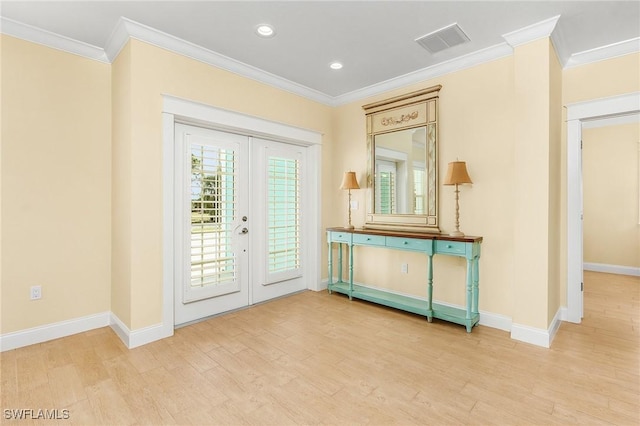 doorway to outside featuring light wood-type flooring, crown molding, and french doors