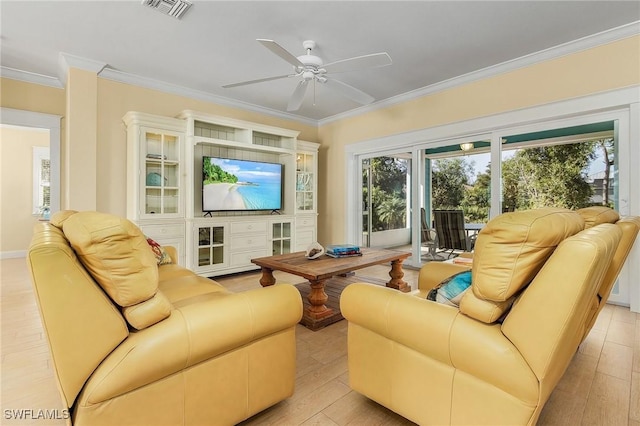 living room featuring light wood-type flooring, ceiling fan, and ornamental molding