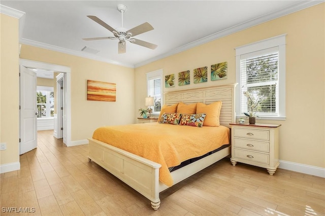 bedroom featuring multiple windows, ceiling fan, and light hardwood / wood-style flooring