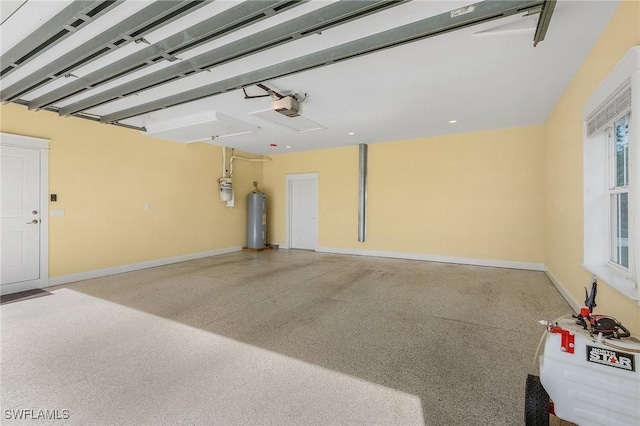 garage featuring electric water heater and a garage door opener