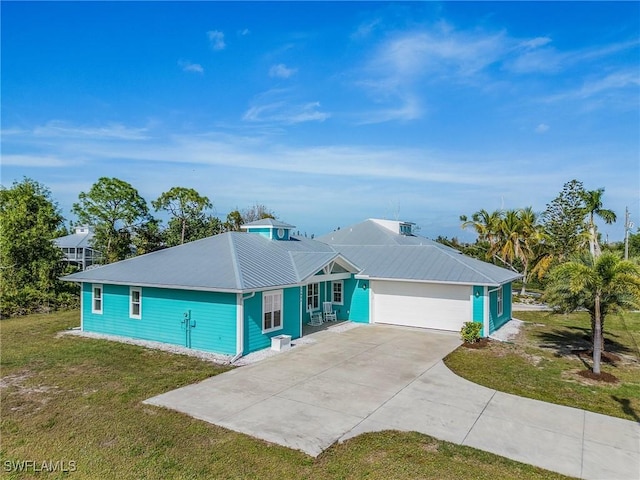 single story home featuring a front lawn and a garage