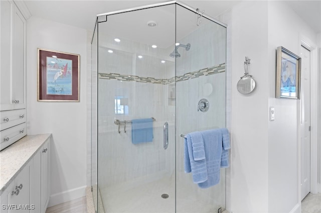 bathroom with vanity and an enclosed shower