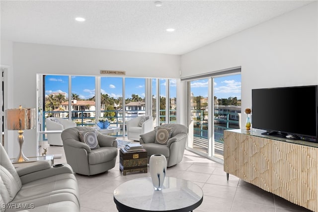 living room with light tile patterned floors and a textured ceiling