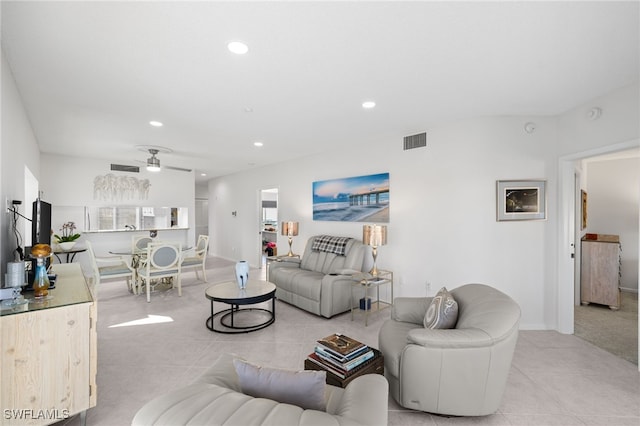 tiled living room featuring ceiling fan