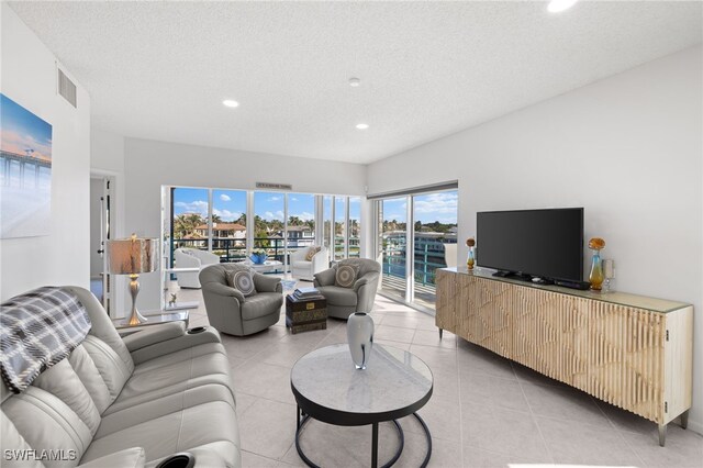 tiled living room with a textured ceiling