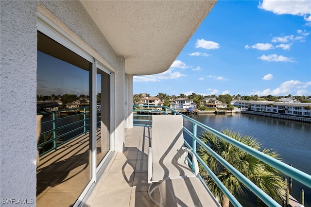 balcony featuring a water view