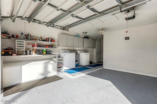 garage with ceiling fan, a garage door opener, and washing machine and clothes dryer